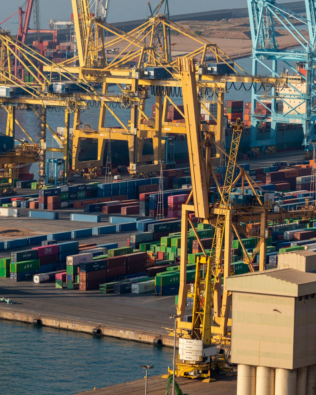 Cranes and shipping containers at a global trade port